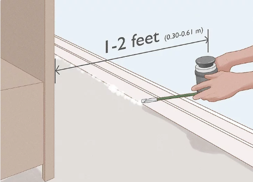 Applying DE along baseboard to kill bed bugs Applying DE along baseboard to kill bed bugs